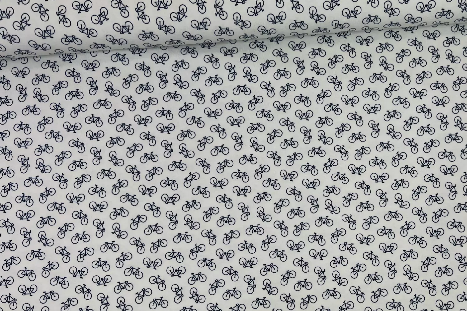 Jersey Stoff mit kleinen Fahrrad Motiven in ecru