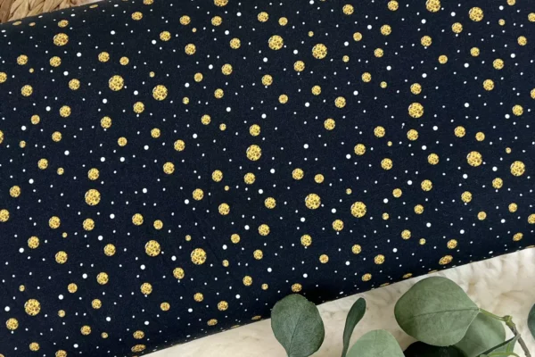 French Terry Stoff – goldene Punkte in schwarz
