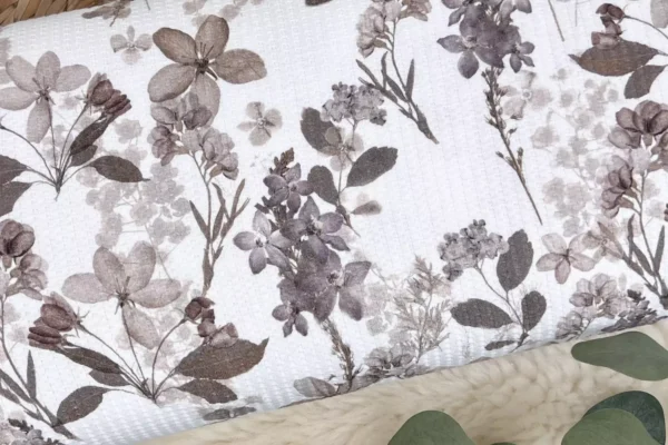 gemusterter Waffeljersey Stoff mit Blumen Muster in erdfarben